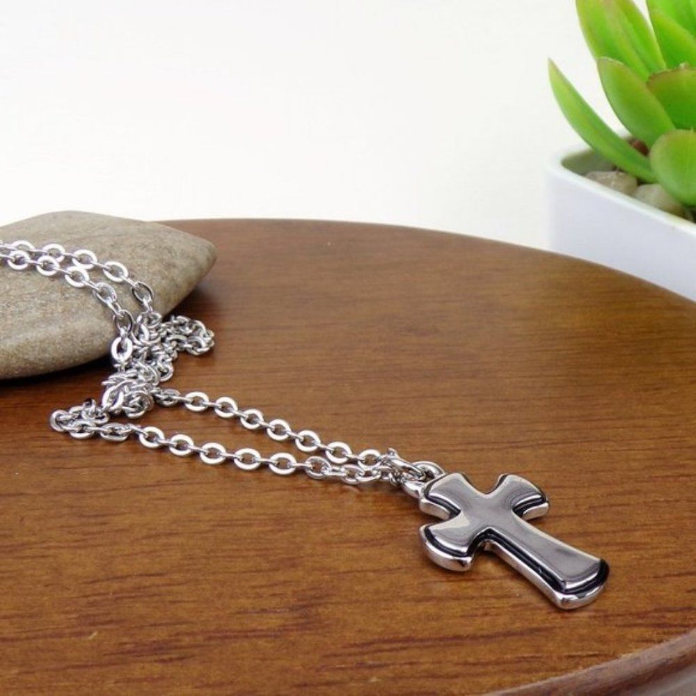 Cross charm silver tone chain necklace.